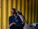Rodent trainer Neema Justin, 33, shares a moment with an African giant pouched rat after an exercise in detecting illegal wildlife products at the Apopo training facility in Morogoro, Tanzania. Apopo's staff often form close bonds with their rats.