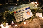 A sign for 37-year-old Alex Pretti, who was fatally shot by a U.S. Border Patrol officer earlier in the day, is displayed during a vigil Saturday, Jan. 24, 2026, in Minneapolis.