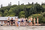 Rain or shine, the cold plunge crew gathers just ahead of 8 a.m. on Sunday mornings in front of the bathhouse at Seattle's Golden Gardens Park. Entering the water is a communal activity, how long you stay is up to you.