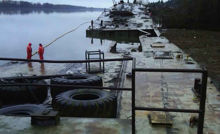 Washington State and U.S. Coast Guard officials found the 431-foot Davy Crockett buckling in the middle in January 2011. It was sending oil sheens miles down the Columbia River. 