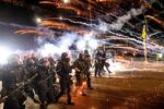 Police use chemical irritants and crowd control munitions to disperse protesters during a demonstration in Portland, Ore., Saturday, Sept. 5, 2020. 