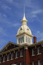 Close up of the white cupola atop the red brick Oregon hospital