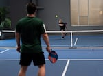 Jesse Proctor, right, plays pickleball with John Cusik at Jumbo's Pickleball on Aug. 6, 2026.