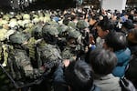 Soldiers try to enter the National Assembly building in Seoul earlier this week after South Korean President Yoon Suk Yeol declared martial law.