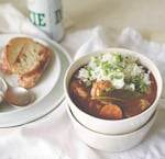 Asian and Cajun/Creole ingredients — lemongrass, Creole seasoning, fish sauce — brighten and enliven  Chicken, Shrimp and Andouille Sausage Gumbo, served with rice. The recipe is featured in the cookbook "Portland Cooks."