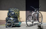 A bike and trailer sit outside the Salvation Army building in Pendleton, Ore., on May 3, 2026, during Sunday lunch provided by Altrusa of Pendleton, a local community organization.