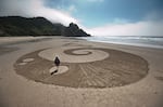 Sand art, like this piece pictured in July 2021, is an example of something that enhances Cascade Head Biosphere without leaving a long-term footprint.
