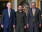 Ukrainian President Volodymyr Zelensky (C) walks with Senate Majority Leader Chuck Schumer (R) and Senate Minority Leader Mitch McConnell (L) during a trip to Washington last month.