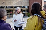 Parents Against Bad Books co-founder Carolyn Harrison (center) talks with people last month outside the public library in Idaho Falls, Idaho, about what she considers obscene books on the shelves.