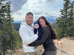 Jacob Flickinger, who was an aid worker with World Central Kitchen in Gaza, pictured with his partner, Sandy Leclerc, and their son Jasper Flickinger.