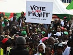 A Labour Party supporter holds a placard during a campaign rally at Adamasingba Stadium in Ibadan, southwestern Nigeria, on Nov. 23, 2022. Nigerians go to the polls on Saturday to choose their next president.