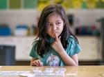 Valentina Sedano Valdez considers what consonant blend she hears during a reading lesson in Coral Walker’s first grade class at Lent Elementary.