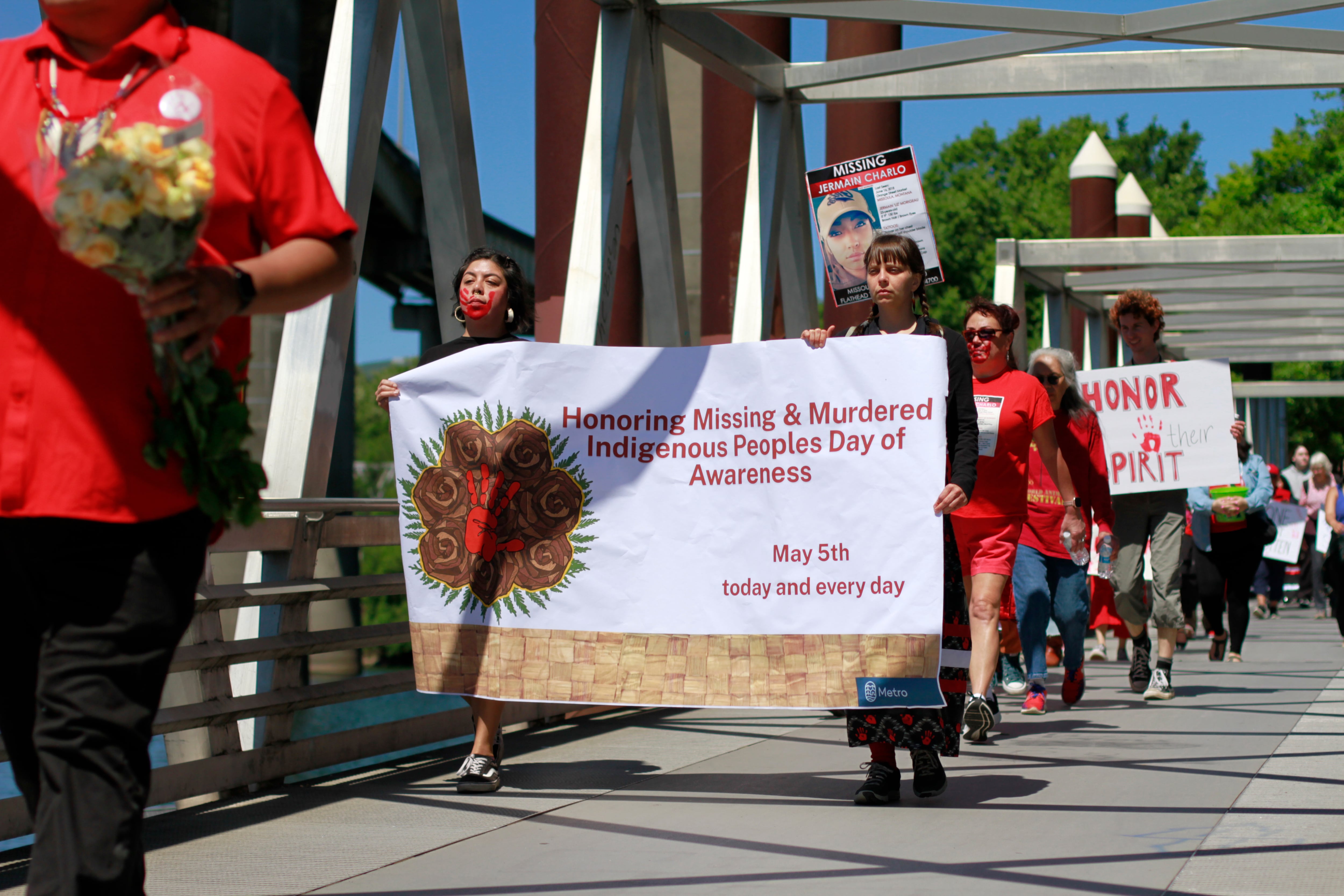 On May 5, 2025, dozens marched from the Oregon Convention Center Plaza down to the Willamette River waterfront for a “letting go” ceremony during the MMIR Day of Awareness and Action hosted by the Portland MMIR Committee.
