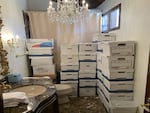 In this photo provided by the U.S. Department of Justice, stacks of boxes can be observed in a bathroom and shower in Mar-a-Lago's Lake Room in Palm Beach, Fla.