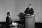 GOP vice presidential candidate Robert Dole (R) listens as his opponent, Democrat Walter Mondale, makes a point during their nationally televised debate at Houston's Alley Theater on Oct. 16, 1976.