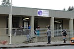 FILE - Patients line up to pick up medication for opioid addiction at a clinic in Olympia, Wash., on March 27, 2020. In 2021, lawmakers in Washington state started the Recovery Navigator Program, a new law that carved out a path for police to steer users toward social services rather than taking them to jail.