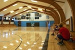 Staff members sit on the bleachers in the gym at Wheeler High School in Fossil, Ore., Tuesday, June 4, 2019.