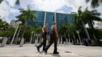 Miami-Dade Sheriff deputies walk in front of the Wilkie D. Ferguson Jr. federal courthouse building in Miami on Friday.