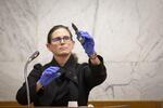 Portland police detective Michele Michaels displays evidence, including the belongings that were on Jeremy Christian when he stabbed three people on a MAX train in May 2017, during day six, February 4, 2020, of testimony in the trial.