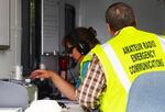 Members of the Oregon Office of Emergency Management's Amateur Radio unit conducting a statewide Simulated Emergency Test using High Frequency Radio in the OEM's Continuity of Operations Trailer.