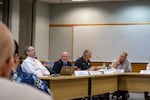 Newberg staff and board members at a board meeting on Sept. 13, 2022. From left: Director of Human Resources Scott Linenbergerm, Superintendent Stephen Phillips, board chair Dave Brown and board member Trevor DeHart.