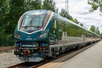 A sleek new Amtrak Cascades train passes through the Willamette Valley in July 2026 on a test run. Regular service with this next-generation train model begins in Washington and Oregon on Sept. 30, 2026.