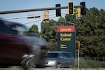 Vehicles speed down Kipling Street past the main entrance to the Denver Federal Center on Sept. 28, 2023