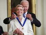 President Joe Biden presents the Presidential Medal of Freedom to Megan Rapinoe, soccer player and advocate for gender pay equality, during a ceremony in the East Room of the White House on July 7, 2022.