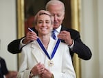 President Joe Biden presents the Presidential Medal of Freedom to Megan Rapinoe, soccer player and advocate for gender pay equality, during a ceremony in the East Room of the White House on July 7, 2022.