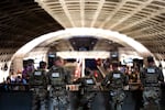 National Guard Military Police watch as trains arrive and depart during rush hour at L'Enfant Plaza station on Sept. 4 in Washington, D.C.