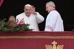 Pope Francis waves before delivering the Urbi et Orbi (Latin for 'to the city and to the world' ) Christmas' day blessing from the main balcony of St. Peter's Basilica at the Vatican, Wednesday, Dec. 25, 2024.