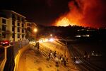 Students evacuate from Pepperdine University as the Franklin Fire burns in Malibu, Calif., on Tuesday, Dec. 10, 2024.