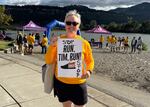 Paddy Cook celebrates her husband Tim Cook's completion of his "Running for Oregon Community College Students" fundraiser in Hood River, Ore., on Aug. 7, 2025.