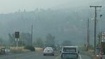 Driving into Ashland, Oregon, the hills are shrouded in wildfire smoke.