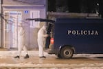 Police investigators work at the site of a shooting in Cetinje, located 22 miles west of Podogrica, Montenegro, Wednesday, Jan 1, 2025.