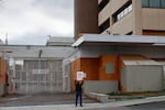 FILE - A protester pictured outside the South Portland Immigration and Customs Enforcement (ICE) building in February, 2026.