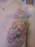 Mary Jane Haake's tattoo of a design of flowers and butterflies on a cancer survivor's breast. 