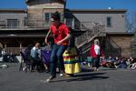 Sipayik resident Chris Sockeeson, center, who belongs to the Passamaquoddy tribe and of the Turning Eagle Drum Group, dances as the group plays in Millinocket, Maine.