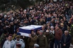 Israeli soldiers carry the flag-draped casket of reservist warrant officer Yuval Nir during his funeral at a cemetery in the West Bank settlement of Kfar Etzion on Wednesday, Jan. 31.