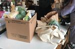 Customers at Northeast Portland's Alberta Co-op Grocery pack their own reusable containers after buying groceries. 