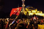 Protesters wave Turkish flags in front of the New Mosque in Istanbul. Despite a government protest ban, mass demonstrations erupted nationwide following the arrest of Istanbul Mayor Ekrem Imamoglu on corruption charges, with crowds demanding democracy and chanting "people, rights, justice." Scholars of democracy view Turkey as a competitive authoritarian regime in which the ruling party uses institutions such as the courts to attack their political opponents.