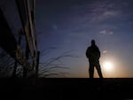 Lateef Dowdell watches the sunrise from what remains of land once belonging to his uncle Gil Alexander, who was the last active Black farmer in the community of Nicodemus, Kan., Thursday, Jan. 14, 2021.