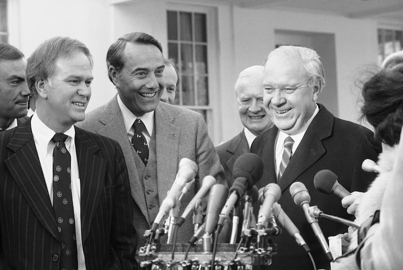 Members of the United States Senate talk to reporters outside the White House, Thursday, Jan. 29, 1981 in Washington, after attending a meeting with President Ronald Reagan. From left are: Sen. Bob Packwood, R-Ore.; Robert Dole, R-Kan.; Harry Byrd, I-Va.; and Russell Long, D-La.