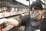 Patty Beavers wears protective gear at Green Zebra grocery in southeast Portland, “I’m just grateful that I’m able to work right now. … Just hang in there, be clean, be safe, this will pass. It always has and it will.”