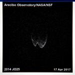 A radar image of asteroid 2014 JO25 from a radio telescope at the Arecibo Observatory/NASA/NSF in Puerto Rico taken on April 17, 2017, is shown on a screen by a member of the Las Vegas Astronomical Society outside the Planetarium at the College of Southern Nevada on April 19, 2017, in North Las Vegas, Nev.