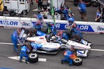 Graham Rahal (15) makes a pit stop during the Freedom 250 Grand Prix auto race, Sunday, Aug. 23, 2026, in Washington.(AP Photo/Allison Robbert)