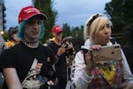 Haley Adams, right, showed up to counter demonstrate at a July vigil in front of Immigration and Customs Enforcement's Portland offices for migrants who have died in ICE custody.