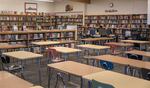 A student sits in the library at David Douglas High School in Portland on September 6, 2023. Due to new cell phone policies in schools across the state, libraries have become places for students to socialize and hang out without screens.