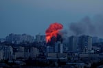 Explosion is seen after Russian air strike on Kyiv, Ukraine, on Friday.