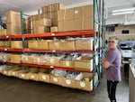 Showers Pass/Vvolt CEO Kyle Ranson stands in his warehouse in Southeast Portland. The manufacturer of rain gear and e-bikes is struggling to bring product over from Asia under President Trump's tariff policy.